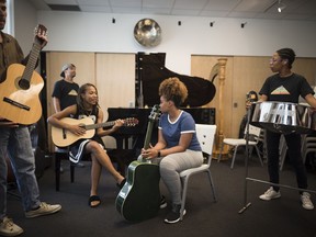 Students featured on Taylor Swift's "Parkscapes" album, prepare to perform their piece featured on the song "It's Nice to Have a Friend," at Regent Park School of Music in Toronto on Monday, August 26, 2019.