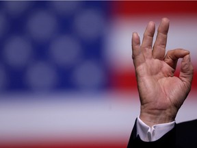 U.S. President Donald Trump gestures to  supporters at a campaign rally in Manchester, New Hampshire, on August 15, 2019.