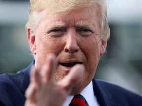 U.S. President Donald Trump speaks to reporters before boarding Air Force One to return to Washington from Morristown Municipal Airport in Morristown, New Jersey U.S. August 18, 2019.