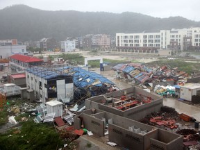Damaged worker accommodation buildings are seen at a construction site in Wenling City, in China's eastern Zhejiang province after being hit by Typhoon Lekima on August 10, 2019.