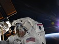 A photo provided by NASA shows astronaut Anne McClain during a spacewalk at the International Space Station on March 22, 2019. NASA is examining a claim that McClain improperly accessed the bank account of her estranged spouse from the Space Station.