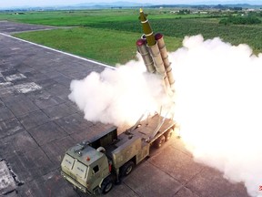 This picture taken on August 24, 2019 and released on August 25 by North Korea's official Korean Central News Agency (KCNA) shows the test-firing of a 'newly developed super-large multiple rocket launcher', at an undisclosed location.