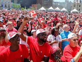 Canadians celebrate during Canada Day festivities on Parliament Hill in Ottawa, Ontario.
