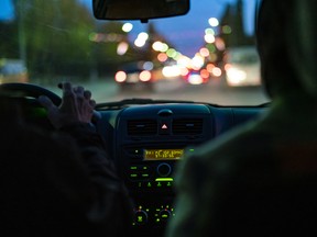 taxi driver in the car in the city traffic f