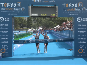 Learmonth and Taylor Brown held hands as they crossed the line after organizers had earlier halved the distance of the running section to five kilometres because of concerns over the extreme heat.