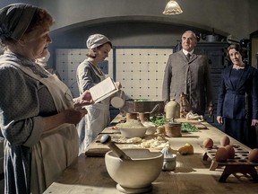 Jim Carter, Phyllis Logan, Lesley Nicol, and Sophie McShera in Downton Abbey.