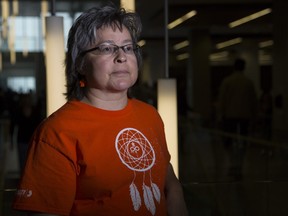 Phyllis Webstad, Indian Residential School Awareness Day keynote speaker and Orange Shirt day co-founder, poses for a photo in her orange shirt at Bow Valley College in Calgary, on September 27, 2016.