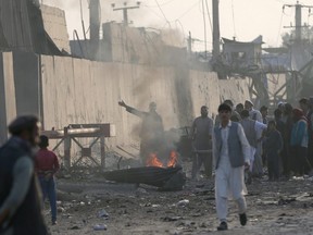 Angry Afghan protesters burn tires and shout slogans at the site of a blast in Kabul, Afghanistan September 3, 2019.