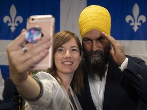 NDP leader Jagmeet Singh poses with a supporter after speaking during a campaign stop in Sherbrooke, Que., Sunday, September 15, 2019.