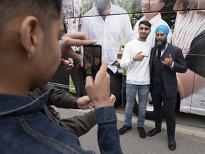 NDP leader Jagmeet Singh poses for photographs with supporters following a campaign stop in Brampton, Ont., Thursday, September 12, 2019. Question-and-answer sessions with reporters are nothing new on the campaign trail -- but Jagmeet Singh's Punjabi exchange today makes clear the growing influence of Canada's South Asian community in key battleground ridings.