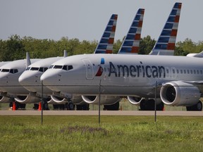 American Airlines Group Inc. Boeing Co. 737 Max planes sit parked outside of a maintenance hangar at Tulsa International Airport (TUL) in Tulsa, Oklahoma, U.S., on Tuesday, May 14, 2019.