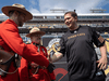 Conservative Leader Andrew Scheer greets two RCMP officers prior to a CFL football game in Hamilton, Ont., on Sept. 2, 2019.