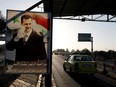 A poster of Syrian President Bashar al-Assad is seen on the main road to the airport in Damascus, Syria, on April 14, 2018.