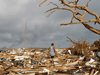 A man walks among debris at the Mudd neighbourhood, devastated after Hurricane Dorian hit the Abaco Islands in Marsh Harbour, Bahamas.