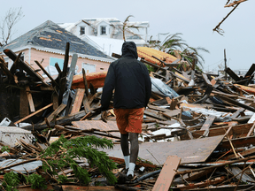 A man walks through the rubble in the aftermath of Hurricane Dorian on the Great Abaco island town of Marsh Harbour, Bahamas.