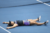Bianca Andreescu lies on the court after winning the U.S. Open.