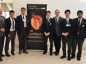 John Walsh, far left, leads the Community and Learning Partnerships program. Here he is pictured with biology students at a cardiac conference.