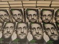 Copies of the book titled 'Permanent Record' by former CIA employee and whistleblower Edward Snowden are for sale on the sidelines of a video conference in that he spoke about the book on September 17, 2019 in Berlin.