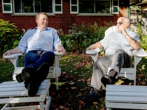 Conservative leader Andrew Scheer (L) speaks with Dennis Matthews, 76, as he campaigns for the upcoming election in London, Ontario on September 24, 2019.