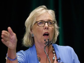 Green Party of Canada leader Elizabeth May, left, speaks with Toronto area candidate Annamie Paul during a fireside chat about the climate, in Toronto, Tuesday, Sept. 3, 2019.