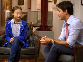 Canada's Prime Minister Justin Trudeau greets Swedish climate change teen activist Greta Thunberg before a climate strike march in Montreal, Quebec, Canada September 27, 2019.