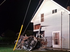 Provincial police say a man has been charged with drunk driving after his car crashed into a house, as shown in this handout image provided by the Ontario Provincial Police, in Midland, Ont., early Wednesday.