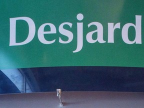 A Caisse Desjardins ATM is seen Tuesday, February 27, 2018 in Montreal. Quebec Provincial Police have questioned 17 people of interest and conducted property searches relating to the breach of personal information of 2.9 million Desjardins Group members.