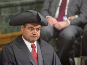 Saskatoon MLA and new speaker Corey Tochor (left) listens to the speech from the throne at the Saskatchewan Legislative Building in Regina, Tuesday, May 17, 2016. Warren Steinley and Tochor resigned as MLAs on Wednesday.