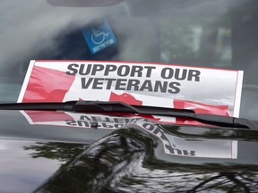 A sign is placed on a truck windshield as members of the advocacy group Banished Veterans protest outside the Veterans Affairs office in Halifax on Thursday, June 16, 2016. Case managers assigned to assist Canada's most severely disabled veterans are complaining that they are being forced to spend the vast majority of their time filling out paperwork rather than helping their patients.