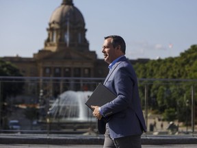Alberta Premier Jason Kenney leaves after discussing the accomplishments of his government in its first 100 days in office, in Edmonton on Wednesday August 7, 2019. Kenney says the Alberta budget will be delivered in just over a month, on October 24.