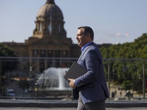 The Alberta Court of Appeal has set aside an injunction that stopped the government from delaying wage arbitration for thousands of public-sector employees. Alberta Premier Jason Kenney leaves a press conference in Edmonton on Wednesday, Aug. 7, 2019.