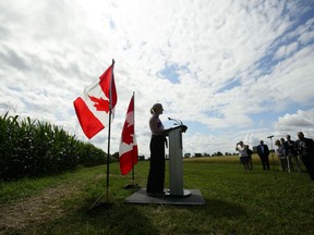 Environment Minister Catherine McKenna announces support for Canada's agricultural sector during a press conference at the Central Experimental Farm in Ottawa on Friday, Aug. 9, 2019. Conservative Leader Andrew Scheer and NDP Leader Jagmeet Singh poured cold water Tuesday on the new Liberal commitment to combat climate change by achieving net zero carbon emissions by 2050.