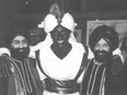 This April, 2001 photo which appeared in a newsletter from the West Point Grey Academy, shows a costumed Prime Minister Justin Trudeau, his face and hands darkened by makeup, attending a "Arabian Nights" gala.