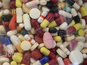 This July 6, 2017, file photo shows prescription drugs in a glass flask at the state crime lab in Taylorsville, Utah. A leading U.S. farmers' organization says it wants the new North American trade agreement renegotiated to fix a major flaw -- one that has nothing do with Canada's much-maligned supply management system for diary.