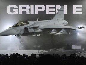 The new E version of the Swedish JAS 39 Gripen multi role fighter being rolled out at SAAB in Linkoping, Sweden, Wednesday, May 18, 2016. Swedish fighter-jet maker Saab says it has not decided whether it will participate in the $19-billion competition to replace the Canada's aging fleet of CF-18s.