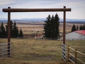 A view through a ranch gate of where a reservoir will be if government plans go ahead, is shown near Bragg Creek, Alta., Friday, April 8, 2016. Alberta's premier says if federal regulators say no, or court delays persist, it's entirely possible the proposed Springbank reservoir ??? a major project designed to protect Calgary from floods - may have to go back to the drawing board.