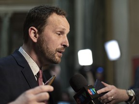 Saskatchewan NDP leader Ryan Meili speaks to media during Budget Day at Legislative Building in Regina on Wednesday March 20, 2019. Meili is challenging Premier Scott Moe to attend an upcoming climate change rally.THE CANADIAN PRESS/Michael Bell