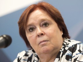 Madeleine Giauque, head of the Quebec government's planned independent bureau to investigate shootings, serious injuries and deaths involving a police officer, speaks to the media Friday, June 17, 2016 in Longueuil, Que. Quebec's police watchdog says officers under investigation should be required to answers the bureau's questions.