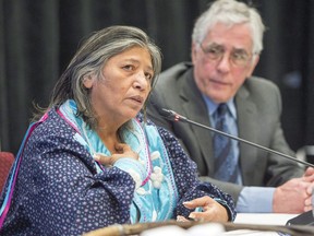 Mohawk elder Sedalia Fazio makes her opening statement as Jacques Viens, head of Quebec's Indigenous inquiry, looks on before the start of proceedings Monday, February 12, 2018 in Montreal. A Quebec inquiry into relations between Indigenous communities and public services in the province will submit its final report today.