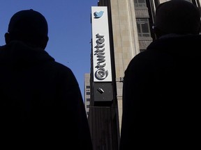 Twitter is giving the all-clear so far for the federal election campaign, saying they have not yet uncovered any instances of large-scale attempts at disinformation or manipulation. Pedestrians cross the street in front of Twitter headquarters in San Francisco, Monday, Nov. 4, 2013.