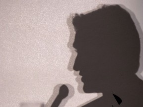 The silhouette of Liberal Leader Justin Trudeau is projected on the background of the stage as he responds to questions following a luncheon speech Friday, February 27, 2015 in Montreal. Polls suggest Canada's 2019 federal election could wind up looking a lot like the 1972 cliffhanger ??? the last time a Trudeau asked Canadians for a second mandate after the first blush of Trudeaumania had dissipated.