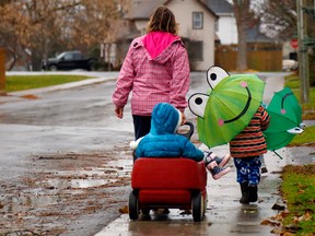 A daycare owner taking her students for a walk in Ontario.