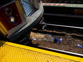 Items on the track where a man was killed on the No. 4 line tracks at the Kingsbridge Road station in the Bronx, Sept. 23, 2019.