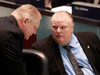Then-councillor Doug Ford, left, speaks with his brother Mayor Rob Ford at a meeting of Toronto city council in 2013.