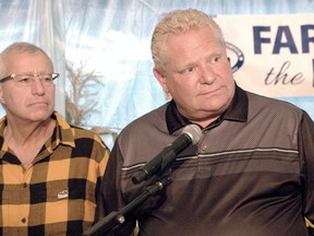 Ontario Premier Doug Ford takes questions from the media at the International Plowing Match in Verner, Ont., with Nipissing MPP Vic Fedeli, provincial minister of economic development, job creation and trade, on Sept. 17, 2019.