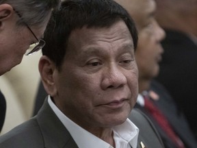 Philippine President Rodrigo Duterte speaks with an official during his meeting with Chinese President Xi Jinping (not pictured) at the Diaoyutai State Guesthouse on August 29, 2019 in Beijing, China.