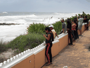 People check out the ocean waves as Hurricane Dorian continues to head toward the Florida coast  on Sept. 2, 2019 in West Palm Beach, Florida.