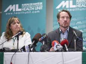 Dr. Chris Mackie, Medical Officer and CEO of Health for the Middlesex-London Health Unit speaks during a press conference in London, Ont., Wednesday, September 18, 2019 as Linda Stobo, manager, Chronic Disease and Tobacco Control at the unit looks on. The announcement involved the first known case in Canada of severe pulmonary illness linked to vaping.
