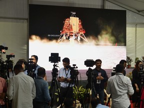 Members of the Indian media cover developments at ISRO Telemetry Tracking and Command Network (ISTRAC) facility in Bangalore, on September 6, 2019, as the countdown for the soft-landing of Vikram lander of Chandrayaan-2, on the surface of the moon, approached.