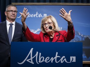 Janice MacKinnon, right, chair of the Blue Ribbon Panel on Alberta's Finances, and Travis Toews, Minister of Finance, speaks to the media about the MacKinnon Panel report on Alberta's Finances in Calgary, Alta., Tuesday, Sept. 3, 2019.THE CANADIAN PRESS/Jeff McIntosh